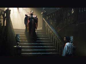 The Master (Eric Roberts) descends the stairs to a waiting Chang Lee (Yee Jee Tso)  