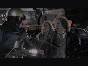Motorcycle policeman (Bill Croft), stops Grace (Daphne Ashbrook), and the Doctor   