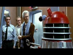 Tom, Brockley (Philip Madoc),  and the Doctor stopped by a Dalek