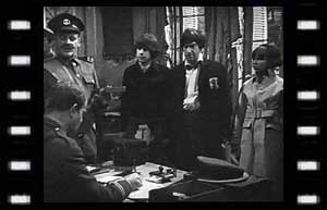 Image of Sergeant-Major Burns (Esmond Webb), Captain Ransom (Hubert Rees) at table, Jamie, Doctor, Zoe