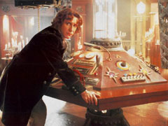 Image of 8th Doctor at console in the other control room